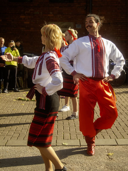 2 members of a Ukrainian dance team in action
